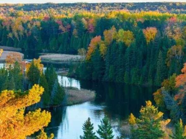 beautiful overlook of fall colors over a river on a fall getaway from chicago