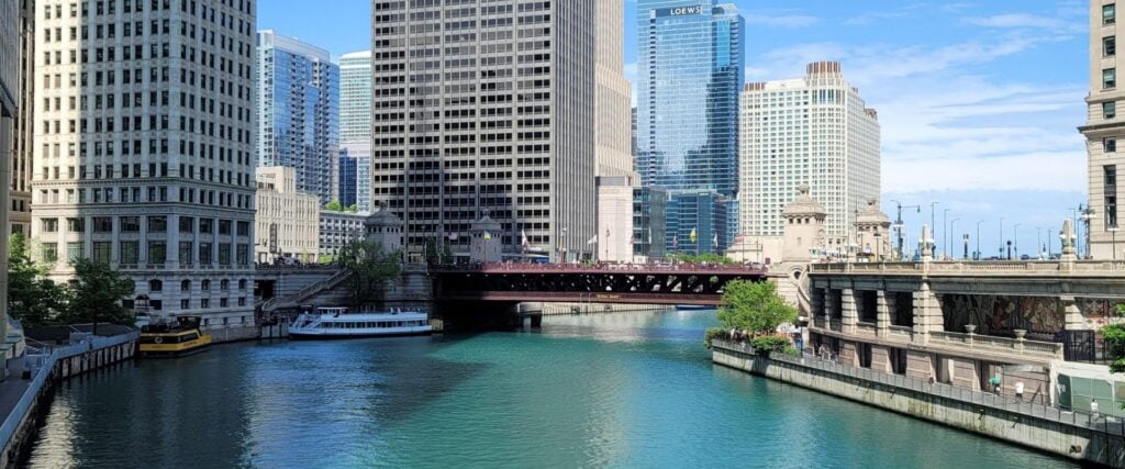 Chicago River with downtown skyline, bridges, and architecture tour boat