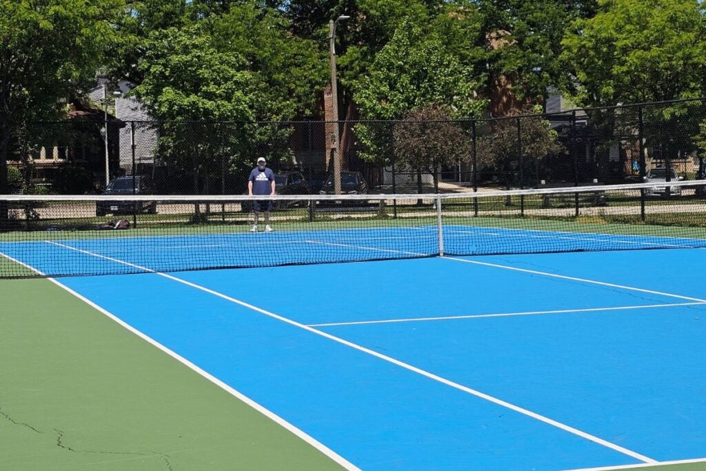 Grant Park tennis courts in Chicago with players and the downtown skyline in the background