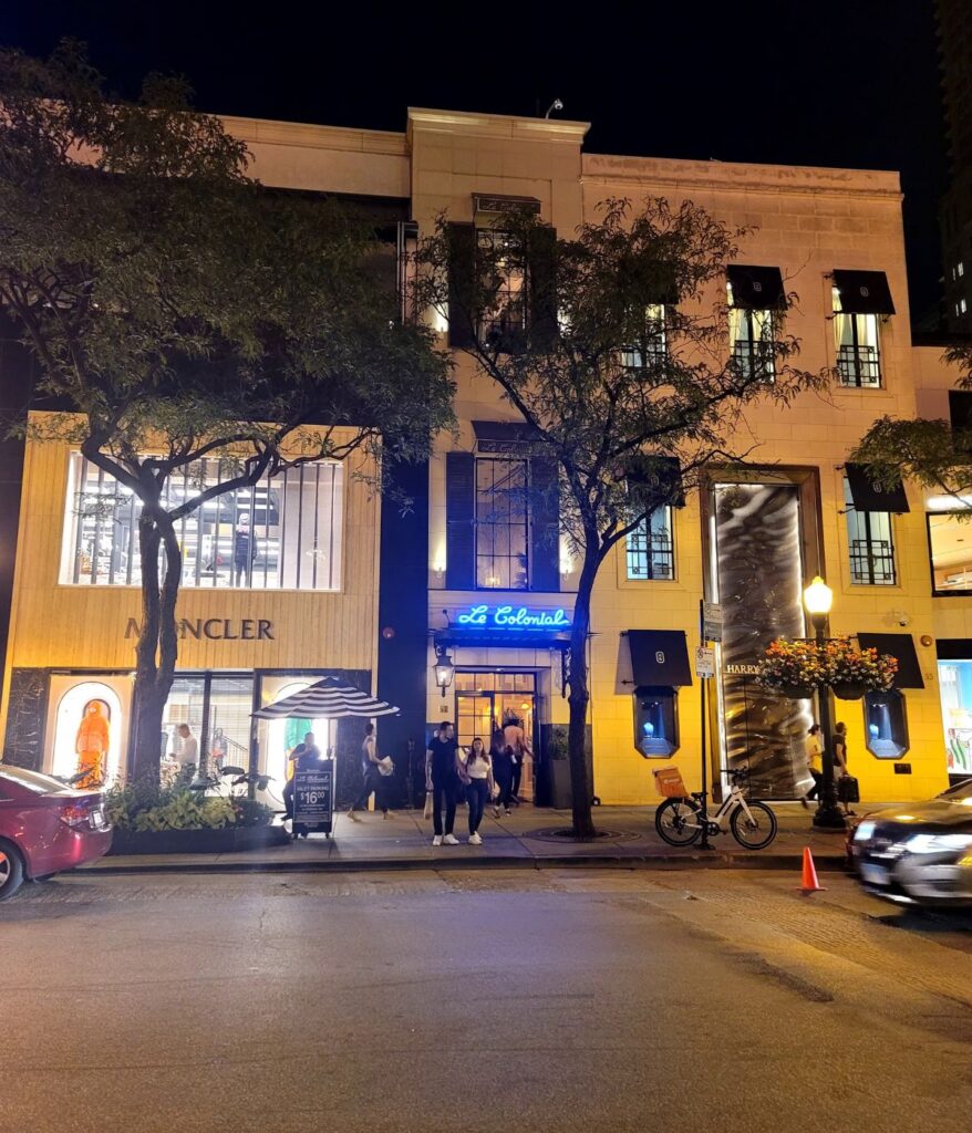 Gold Coast Chicago nightlife with restaurants and bars along a busy street