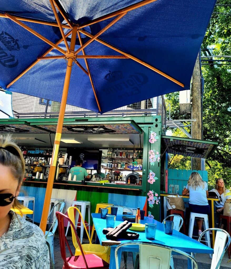 Chicago outdoor dining patio with colorful seating and casual restaurant atmosphere