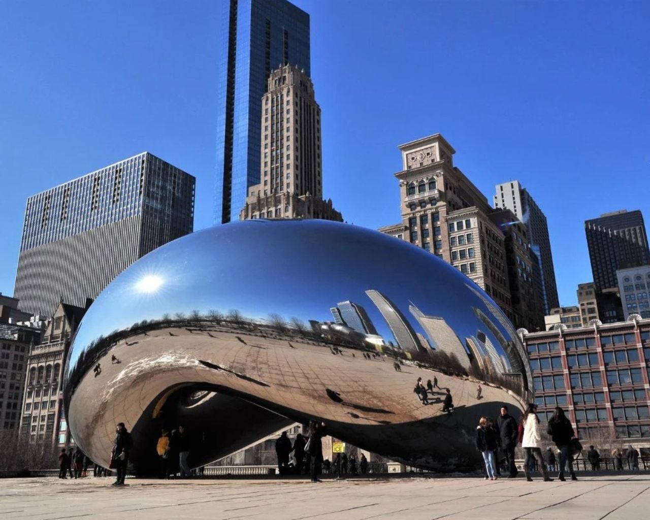 Cloud Gate the Bean reflecting the Chicago skyline at sunset