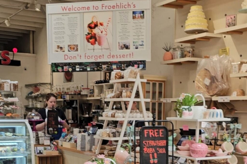 Interior of Froehlich's bakery and market in Three Oaks, Michigan with pastry counter and shelves