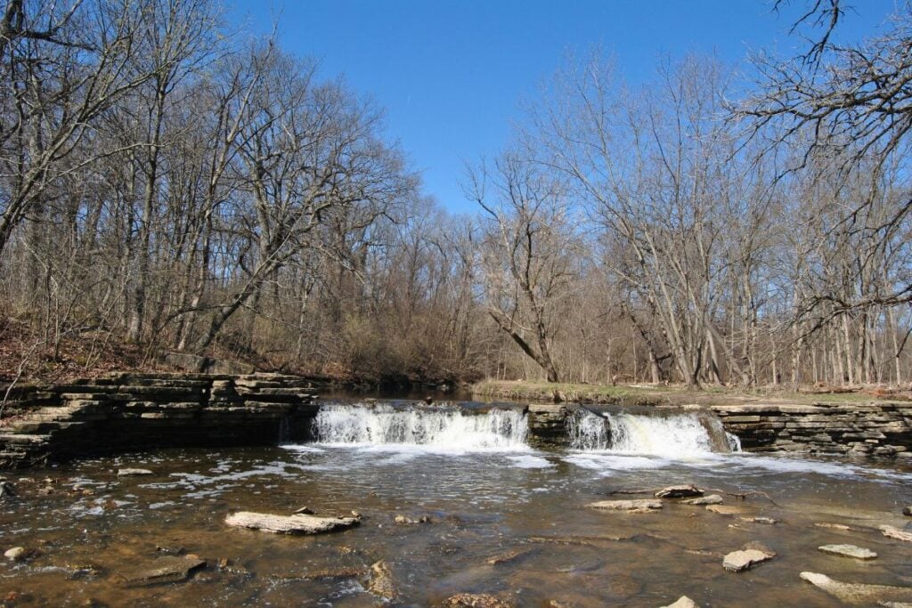 Rocky Glen waterfall spilling over limestone ledges at Waterfall Glen Forest Preserve in Darien